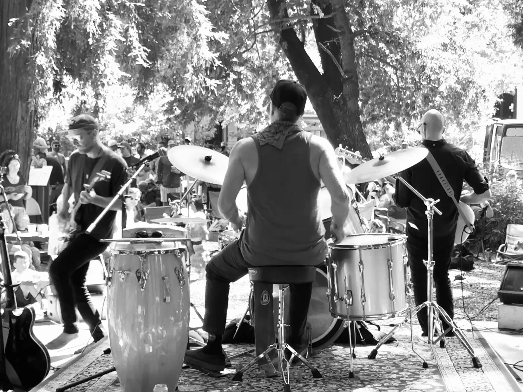 Peri Park from behind the drums, black and white